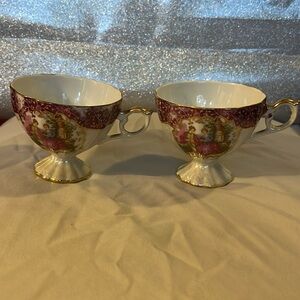 Vintage lusterware 2 teacups  in white, red and gold with fragonard decor.